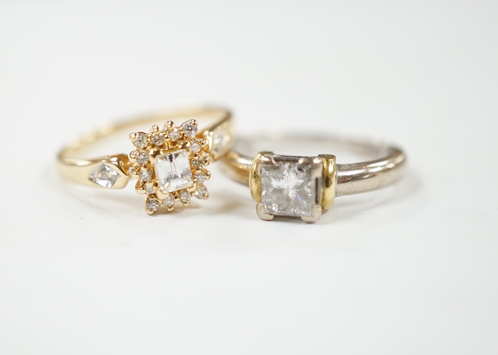A modern two colour 18ct gold and solitaire princess cut diamond set ring, size K/L and one other modern 18ct gold and diamond set cluster ring, size N, gross weight 7.6 grams.